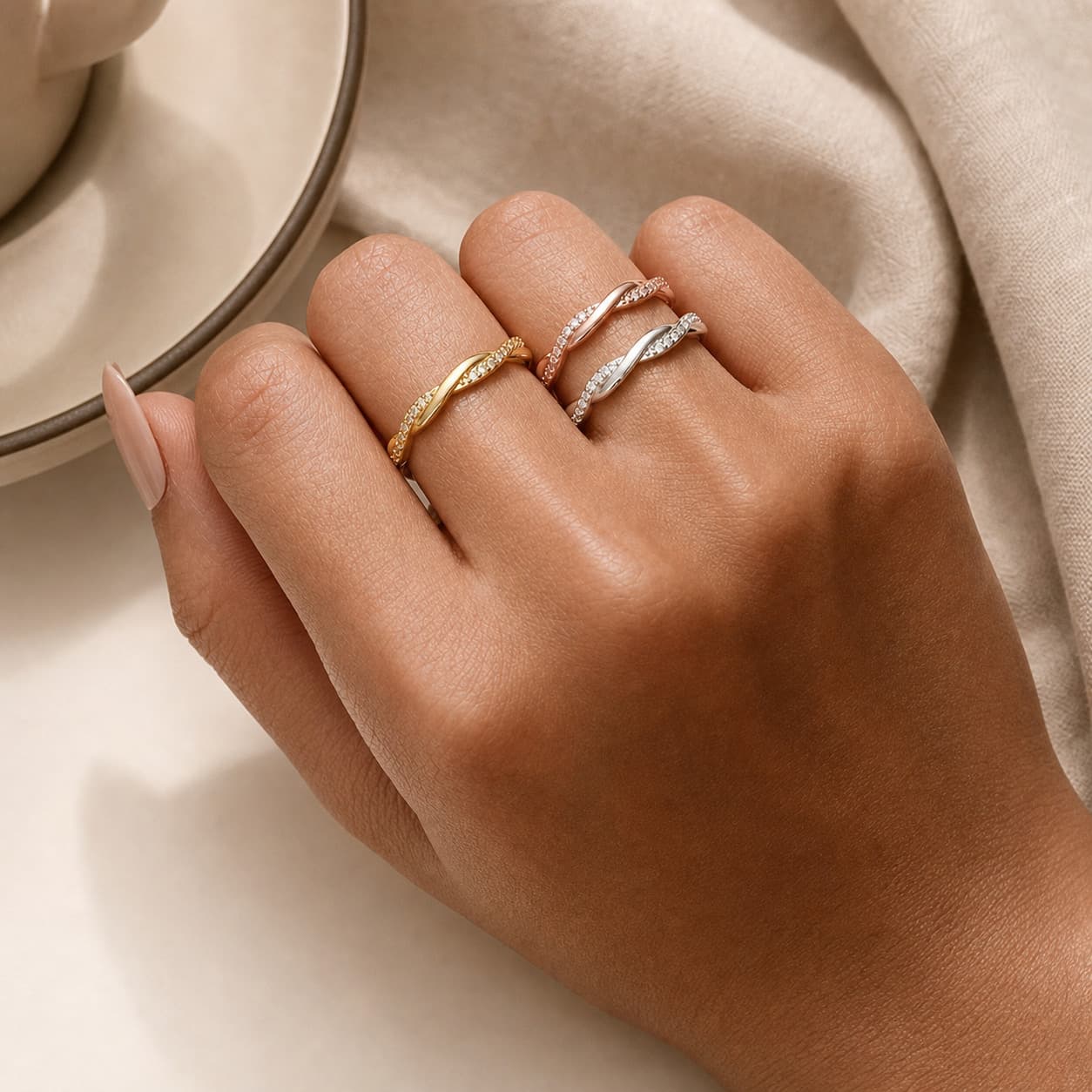 Mixed-finish wave rings worn together